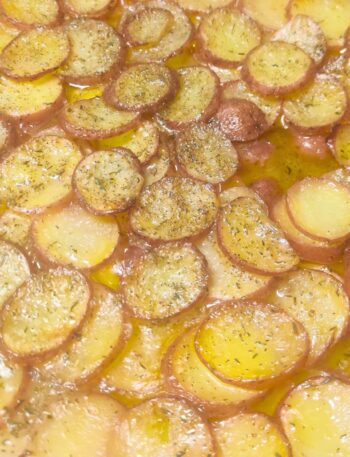 pommes boulangere in a large pan